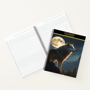 A majestic wolf howling under a full moon at night notebook