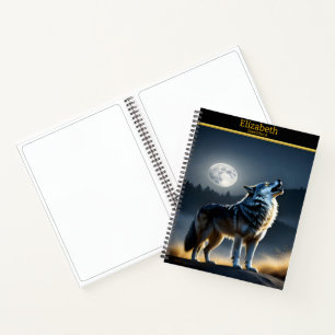 A majestic wolf howls at the luminous moonlight notebook