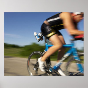 A male athelete training for a triathlon at a poster