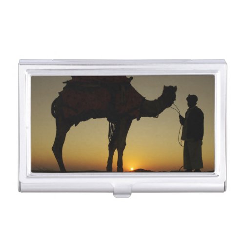a man and his camel Silhouetted at sunset on the Business Card Case