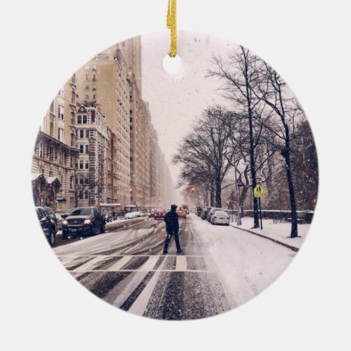 A Man Crossing A Snowy Central Park West Ceramic Ornament