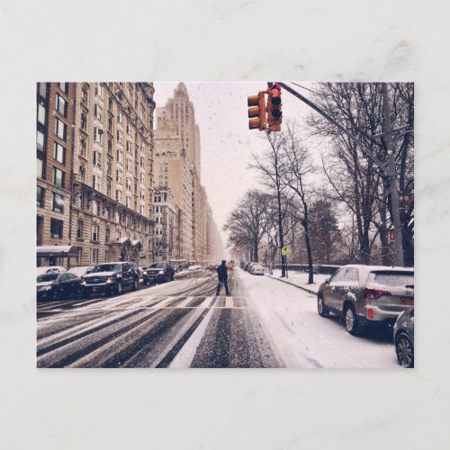 A Man Crossing A Snowy Central Park West Postcard