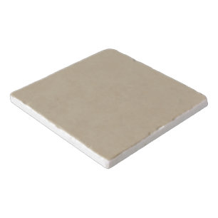 a man in a suit and tie standing in front of a wal trivet