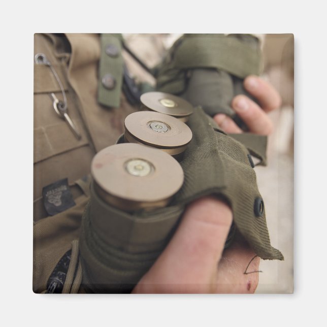 A Marine cradles handfuls of 40 mm grenades Magnet (Front)