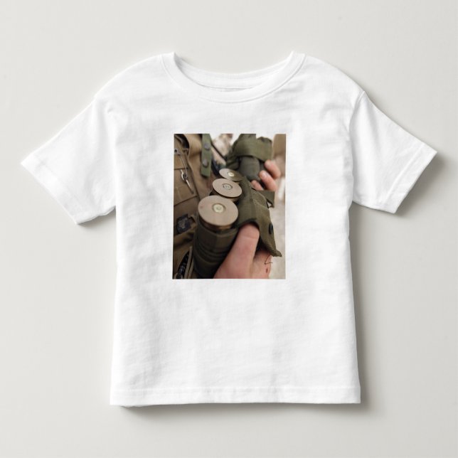 A Marine cradles handfuls of 40 mm grenades Toddler T-shirt (Front)