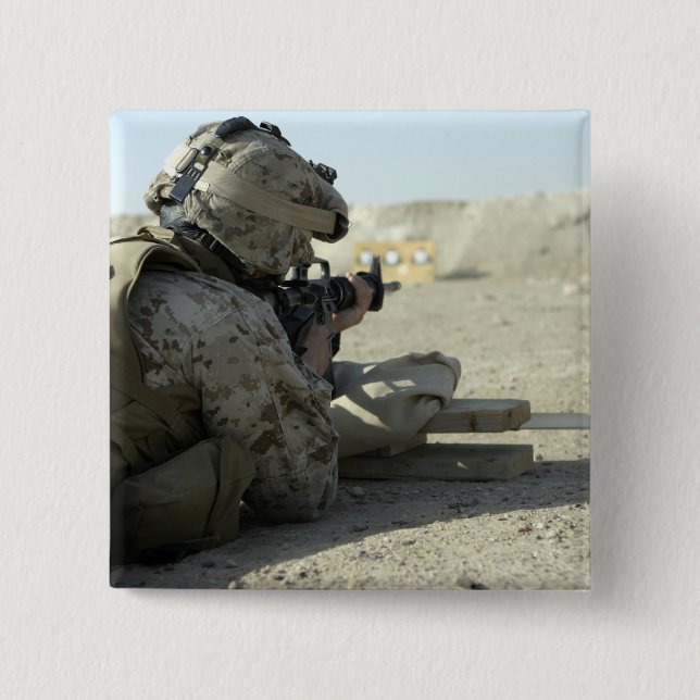 A Marine fires a M16A2 service rifle Button (Front)