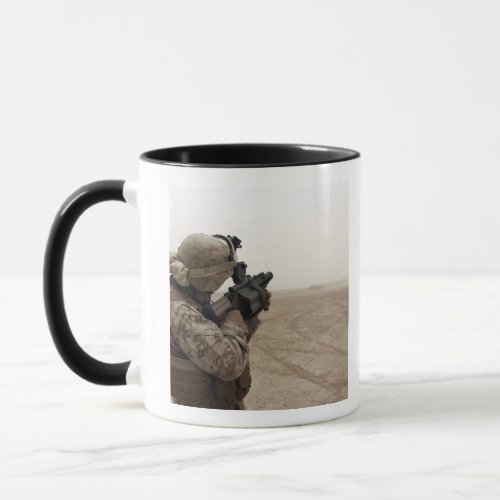 A Marine fires the M_32 Mug