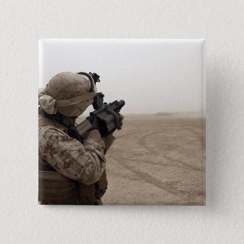 A Marine fires the M_32 Pinback Button