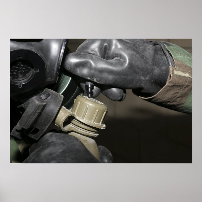 A Marine inserts a drinking tube into his cante Poster (Front)