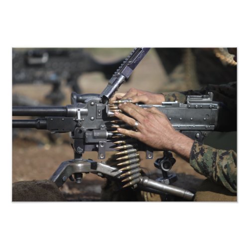 A Marine loads a M_240G machine gun Photo Print