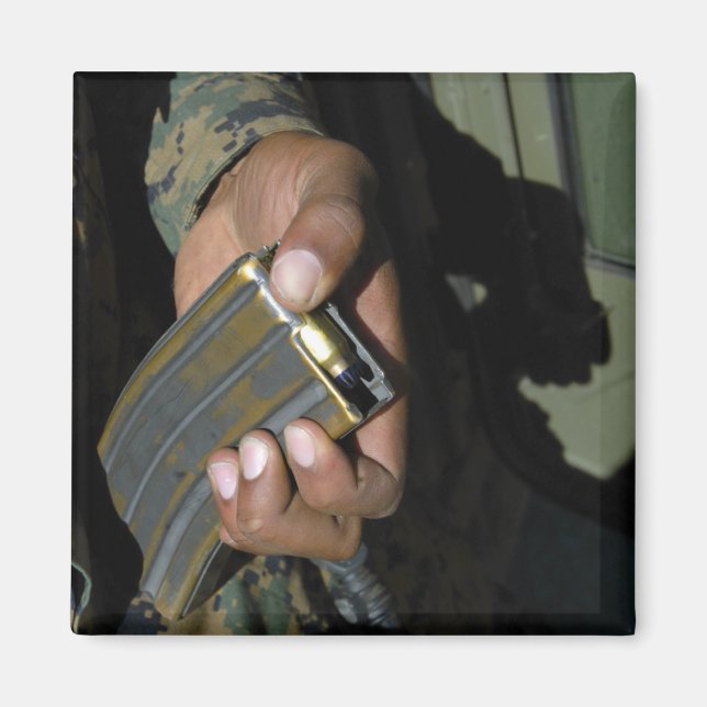 A Marine loads blank ammunition rounds Magnet (Front)