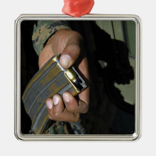 A Marine loads blank ammunition rounds Metal Ornament