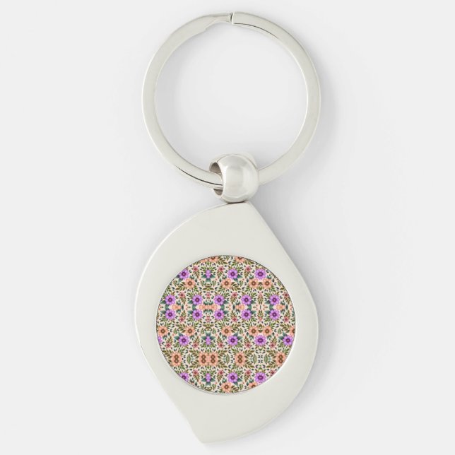 A metallic keychain with a colorful mosaic design  (Front)