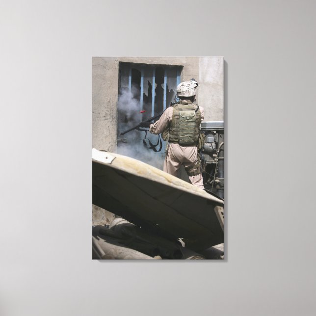 A military policeman uses a breaching round canvas print (Front)