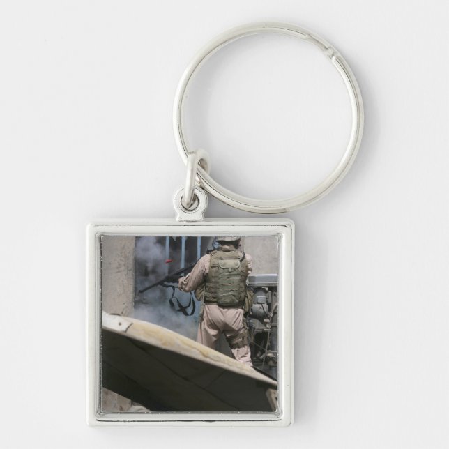 A military policeman uses a breaching round keychain (Front)