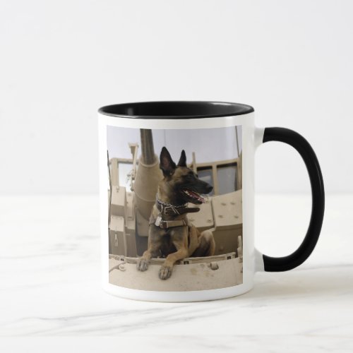 A military working dog sits on a M2A3 Mug