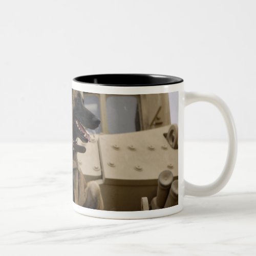 A military working dog sits on a M2A3 Two_Tone Coffee Mug