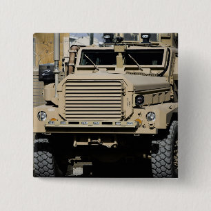 A mine-resistant, ambush-protected vehicle pinback button