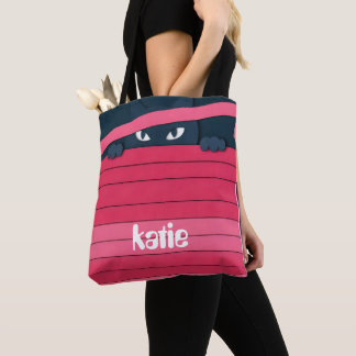 A minimalist stylized cat tote bag
