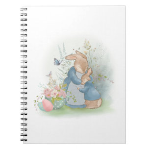A mother rabbit with a baby rabbit in a clearing w notebook
