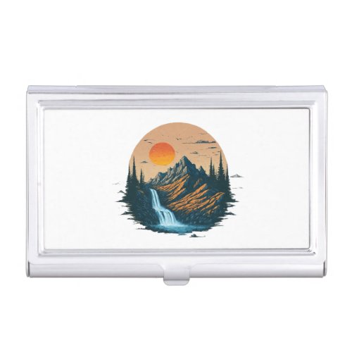 a mountain range with a waterfall business card case