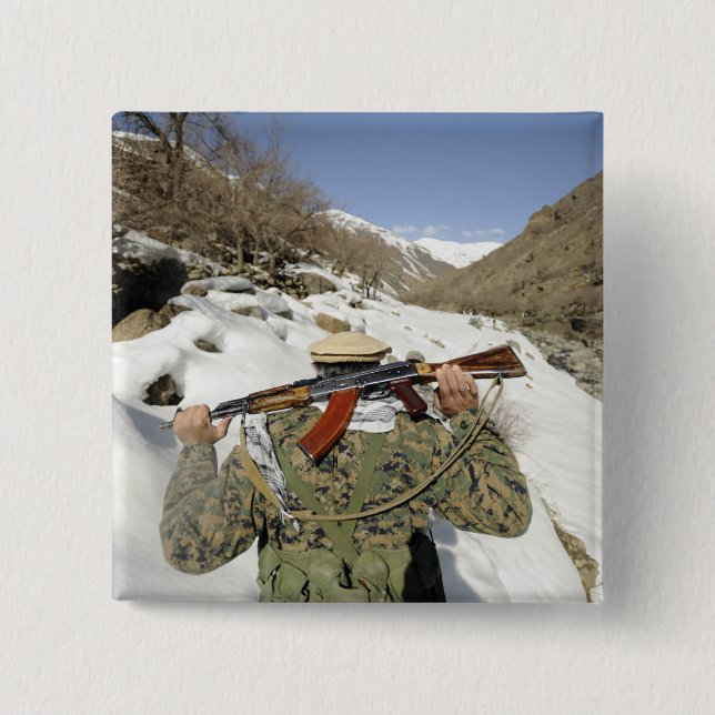 A Mujahadeen Guard walks with US Military membe Pinback Button (Front)