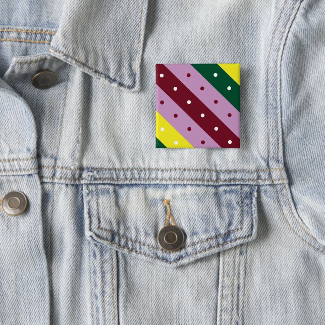 a multicolored striped pattern with dots button (In Situ)
