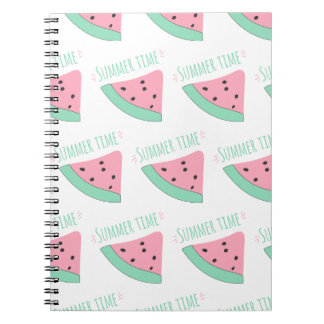 A notebook with an inscription and a watermelon