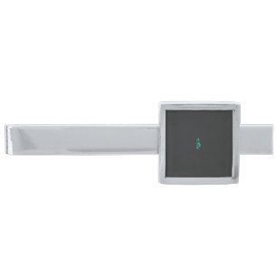 a painting of a flower and a fish on a black backg silver finish tie bar