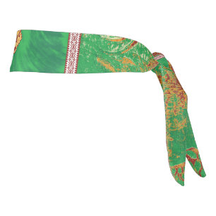 a painting of a green field with an orange border tie headband