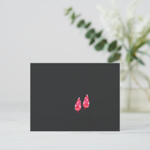 a pair of red leaves on a black background postcard