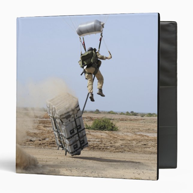A pararescueman drops into the zone binder (Front/Inside)