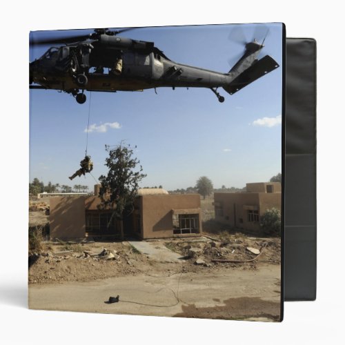 A pararescueman rappels from an HH_60 2 3 Ring Binder