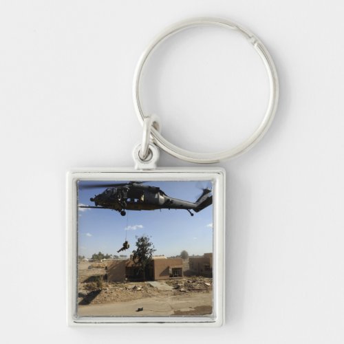 A pararescueman rappels from an HH_60 2 Keychain