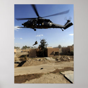 A pararescueman rappels from an HH-60 2 Poster