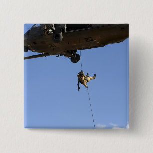 A pararescueman rappels from an HH-60 Pinback Button