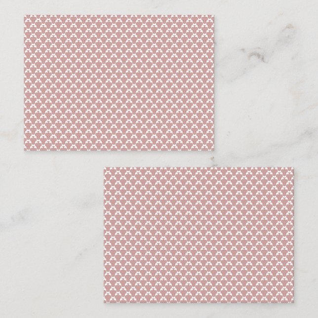 A patterned rug with red and brown motifs lies on  appointment card (Front/Back)