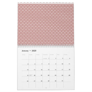 A patterned rug with red and brown motifs lies on  calendar