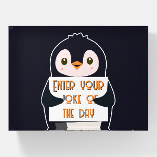 A penguin holding a sign with custom text paperweight
