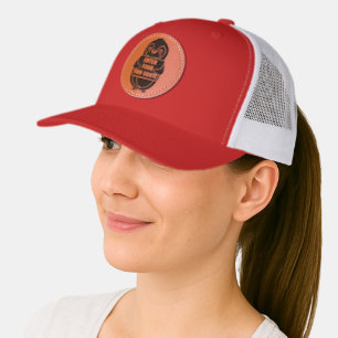 A penguin holding a sign with customizable text th leather patch hat