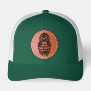 A penguin holding a sign with customizable text th leather patch hat
