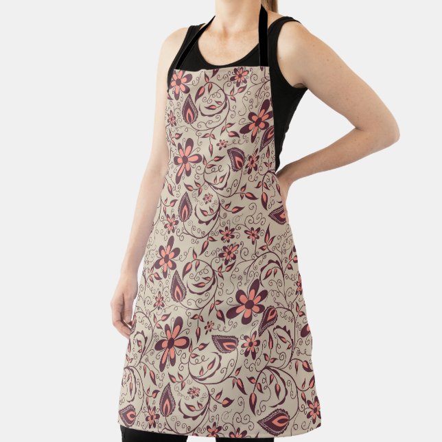 A person wears a floral-patterned apron  (Insitu)