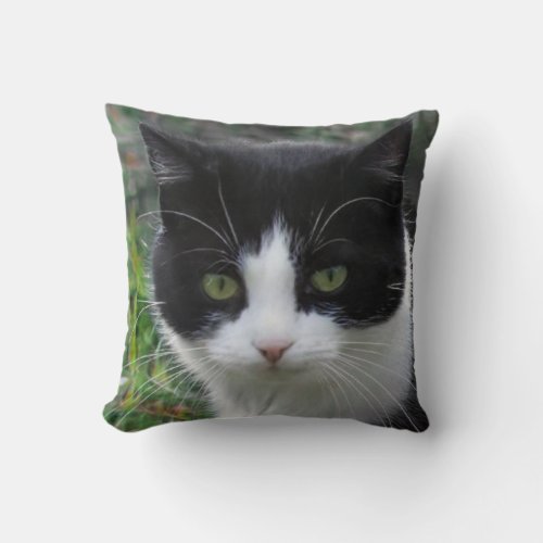 A picture of a cat spotted in black and white throw pillow