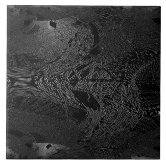 A piece of dark black ceramic with a space eminent ceramic tile