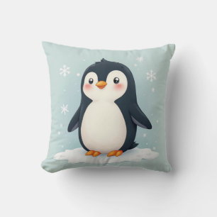 A pillow cushion with a cute penguin picture on it
