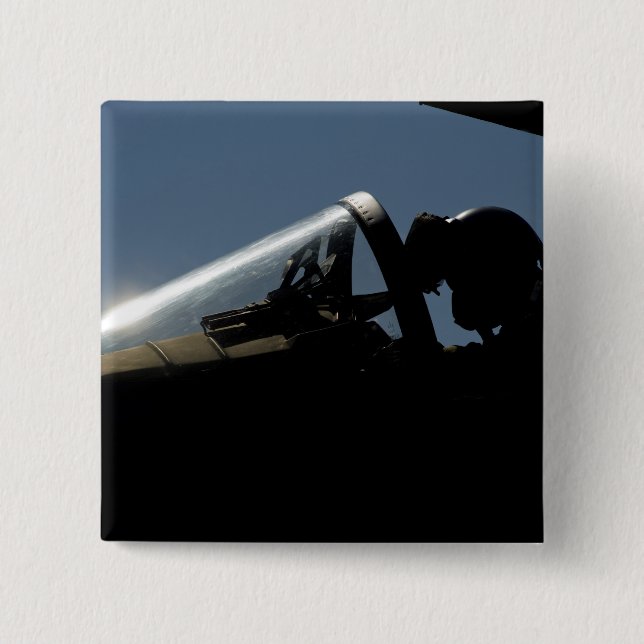 A pilot prepares for take-off button (Front)