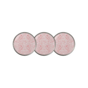 a pink and white abstract design on a white backgr golf ball marker