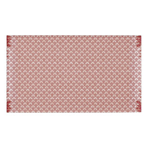 a pink and white background with a pattern name tag