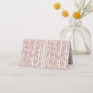 a pink and white striped background place card