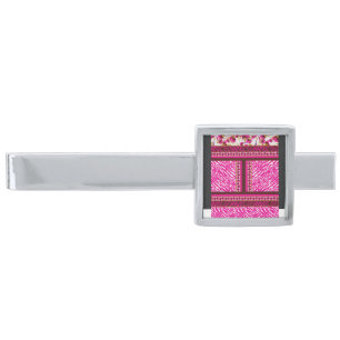 a pink and white wallpaper with a cross on it silver finish tie bar